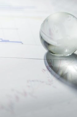 Glass of globe with stock market chart